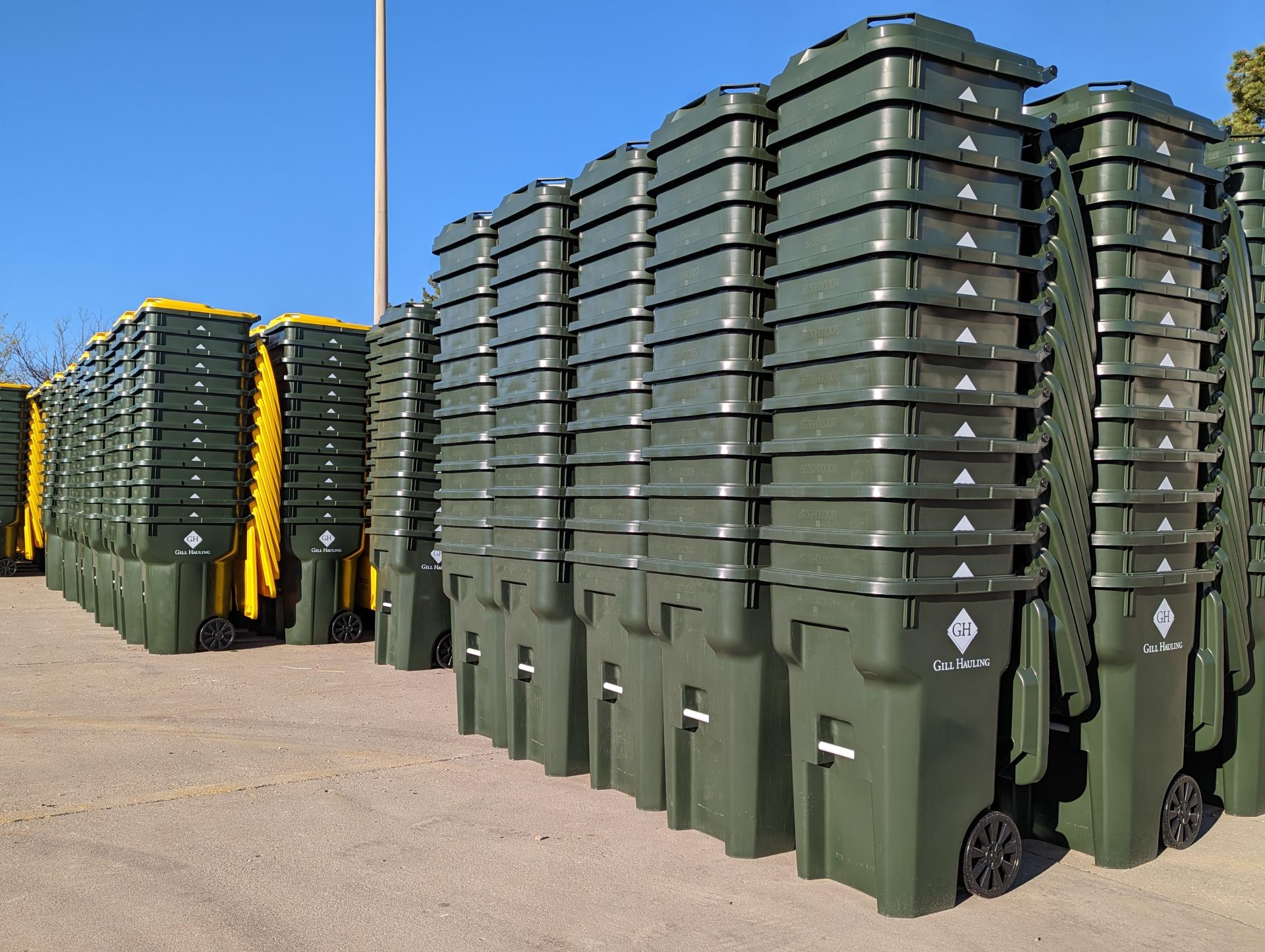 Garbage and recycling bins stacked